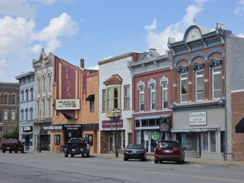 Mostly Victorian mixed-use downtown buildings lining Main Street.