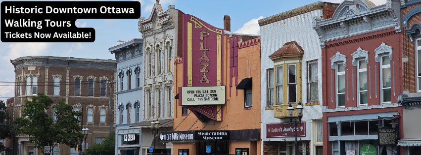 Street scene featuring historic commercial district of mainly Victorian era brick buildings